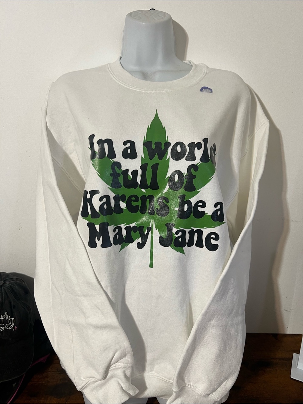 White Sweatshirt with Green Leaf and Black Text